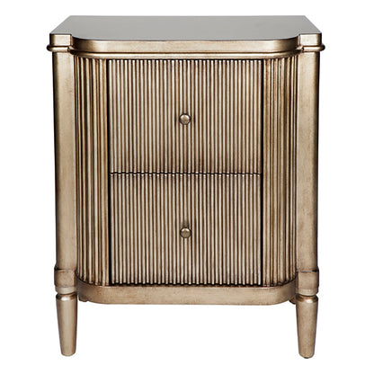 A ribbed, antique gold bedside table with two drawers and decorative ribbed detailing.
