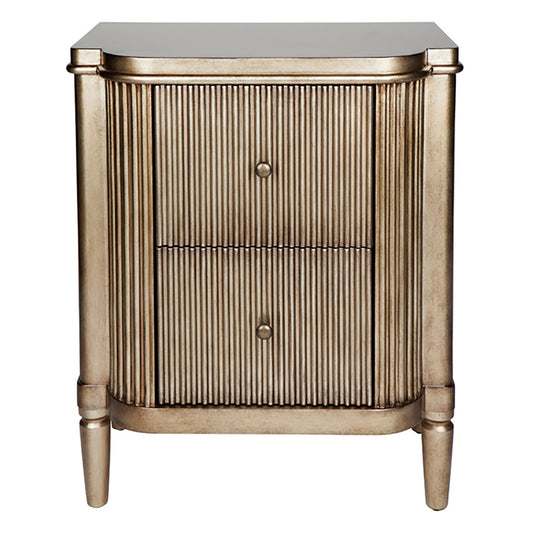 A ribbed, antique gold bedside table with two drawers and decorative ribbed detailing.