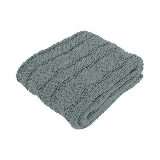 Folded grey knit blanket on a white background | Mirra Interiors