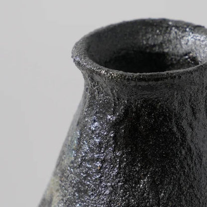 Close-up of a large textured vase for sale featuring a unique finish and artistic design