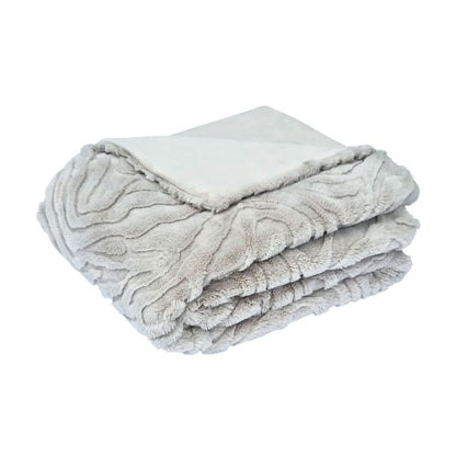 Folded silver grey textured blanket on a white background | Mirra Interiors