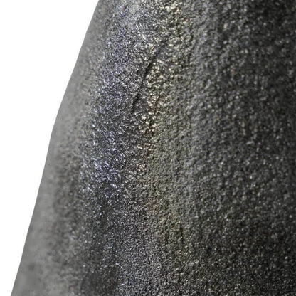 Textured black porcelain vase by Mirra Interiors showcasing a unique surface design