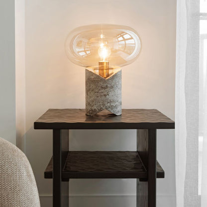 Vela marble and amber glass lamp styled on a side table