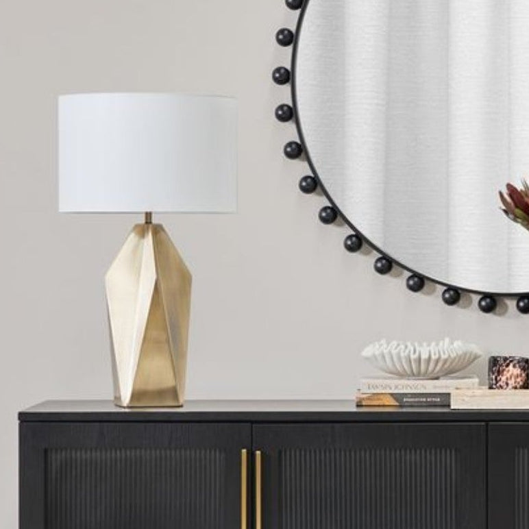 Vesper brass table lamps styled on a console
