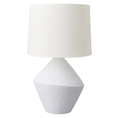 White textured table lamp with a white shade on a white background