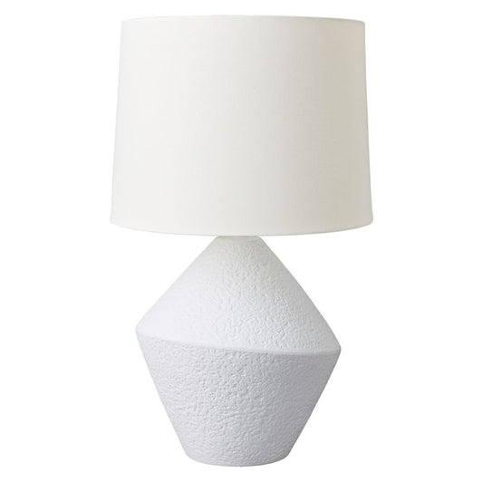 White textured table lamp with a white shade on a white background