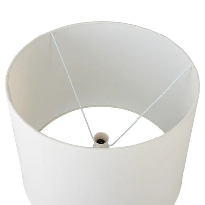 White lampshade with a cylindrical base on a white background